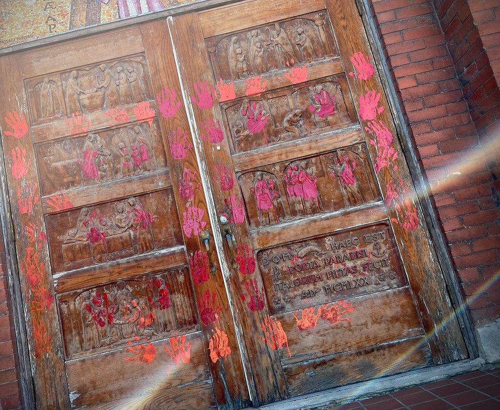 Doors of a Calgary church daubed with paint