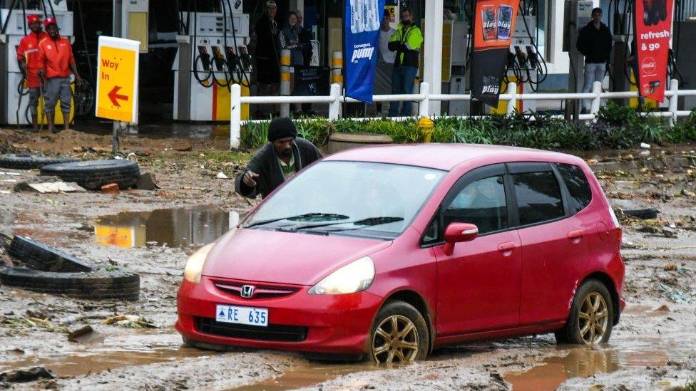 Car stuck in mud and water