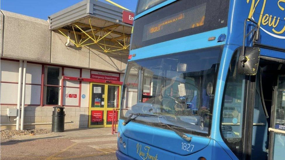 The double decker parked outside the A&E