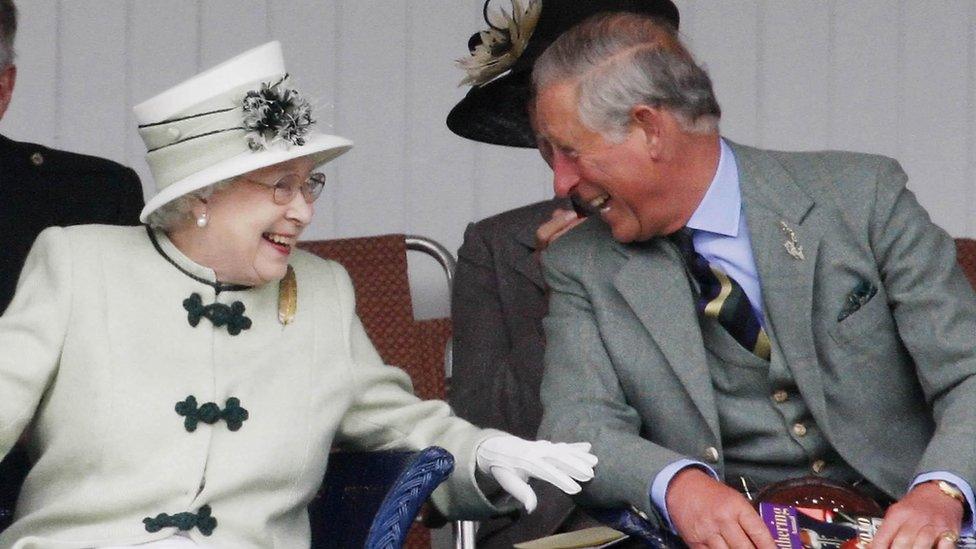 Queen Elizabeth II and King Charles III at the Braemar Highland Games in 2010