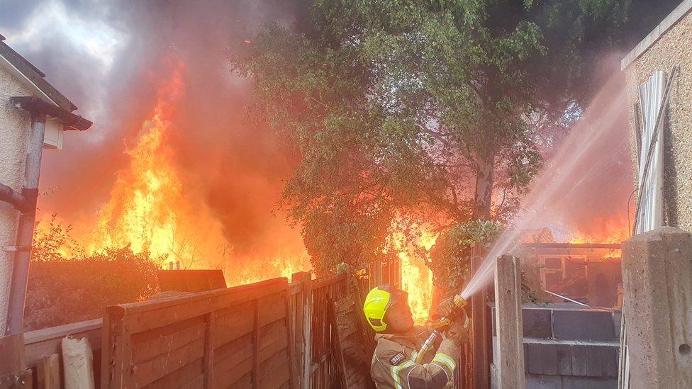 Firefighter tackling blaze