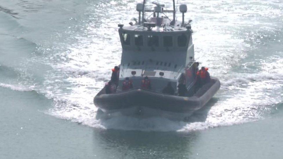 Border Force officers pick up migrants in the Channel