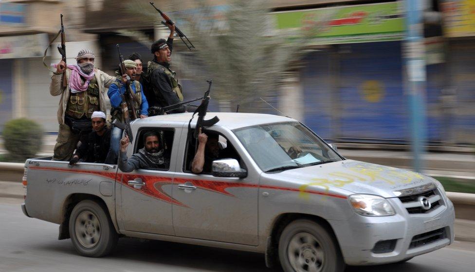 Rebels celebrate in Raqqa after capturing the city on 4 March, 2013.