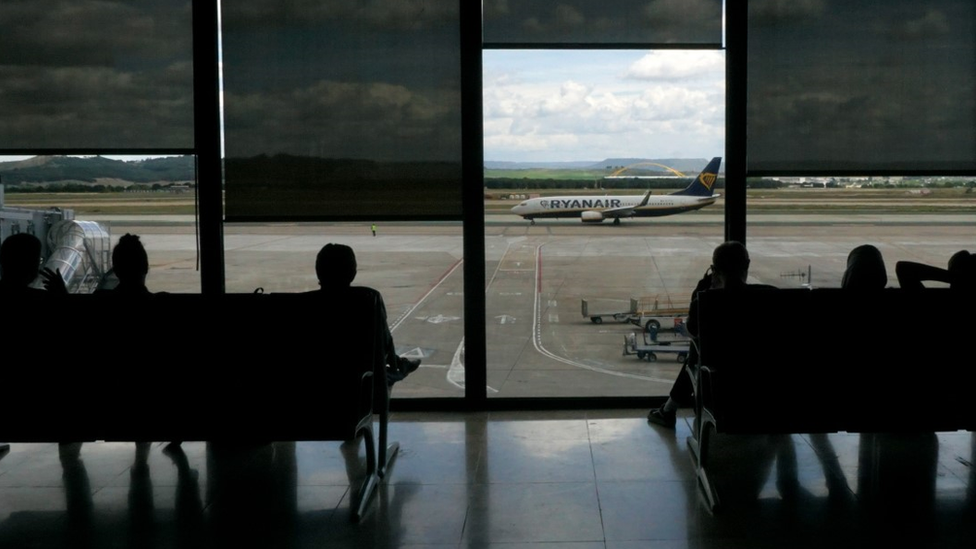 Stock image of people waiting at an airport