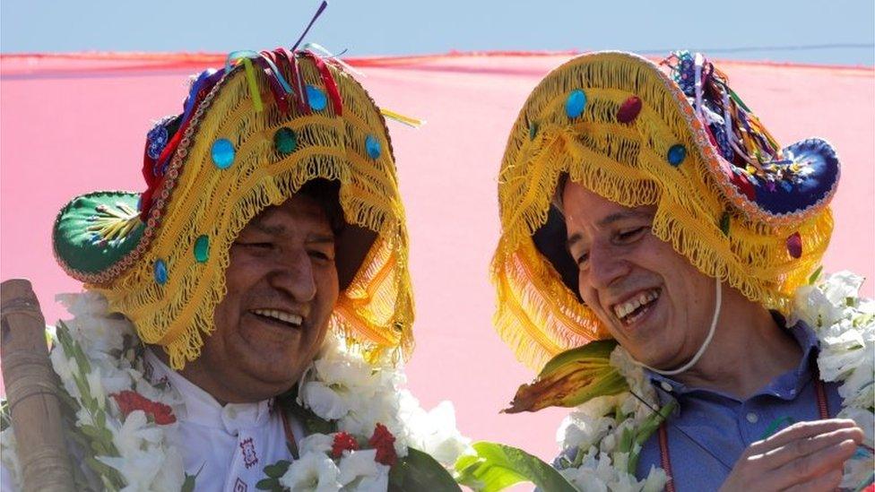 Bolivia's former President Evo Morales and former vice president Alvaro Garcia Linera react during a caravan between Uyuni and Oruro, upon his return to the country, in Uyuni, Bolivia November 10, 2020.