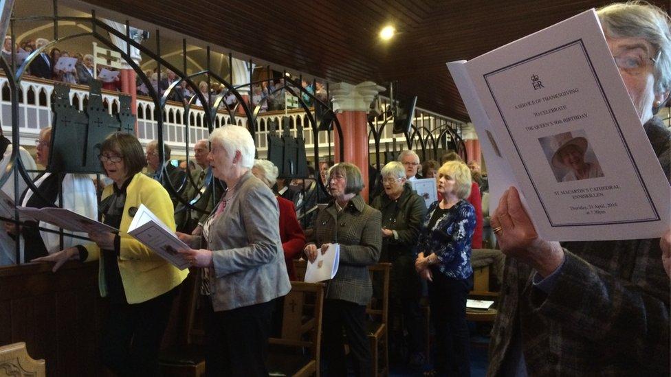 People sing at a thanksgiving service for the Queen's 90th birthday at St Macartin's Cathedral in Enniskillen