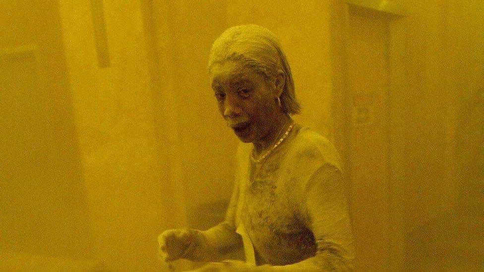 Marcy Borders covered in dust as she takes refuge in an office building after one of the World Trade Center (Centre) towers collapsed in New York, September 11th 2001.