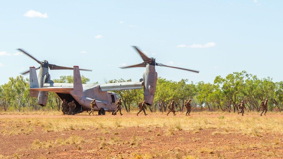 US Marines exit an Osprey helicopter in the NT