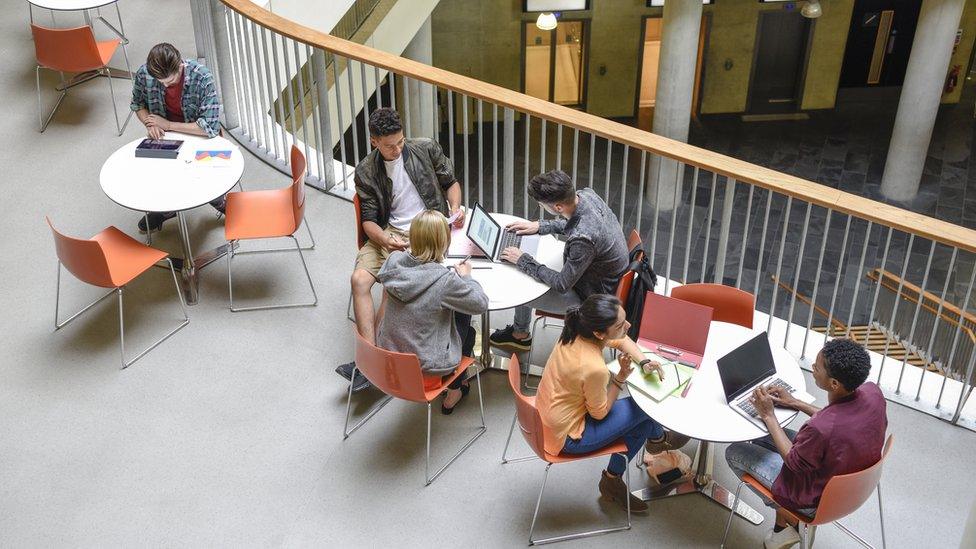 Students at tables studying