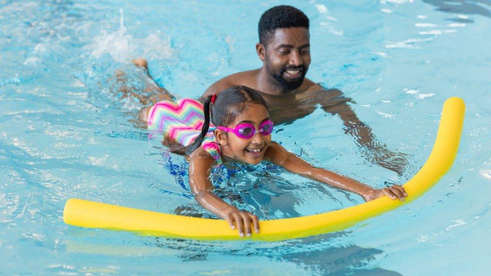 child learning to swim