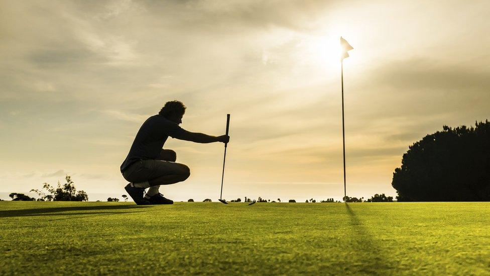 Man playing golf