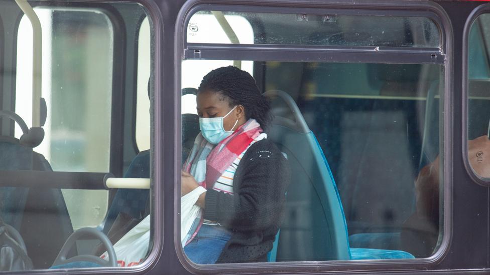 A passenger wearing a protective face mask on a bus in central London, following the announcement that wearing a face covering will be mandatory for passengers on public transport in England