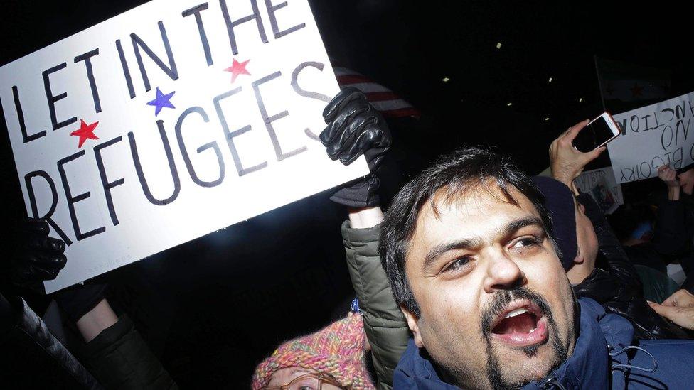 Demonstrators protest against President Trump's executive immigration ban at Chicago O'Hare International Airport