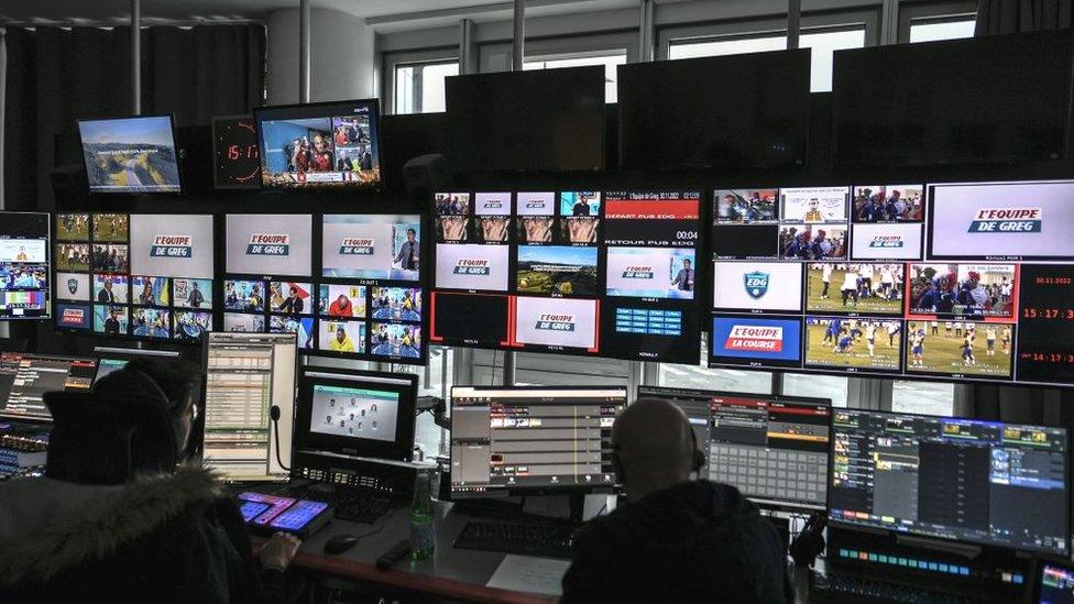 Journalists of the French sports TV channel 'L'Equipe' work in a production control room at 'L'Equipe' headquarters in Boulogne-Billancourt near Paris, on November 30, 2022.