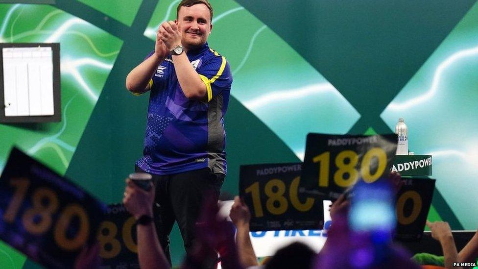 Luke Littler celebrating his win over Raymond van Barneveld