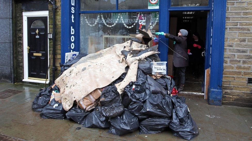 A pile of rubbish outside a bookshop