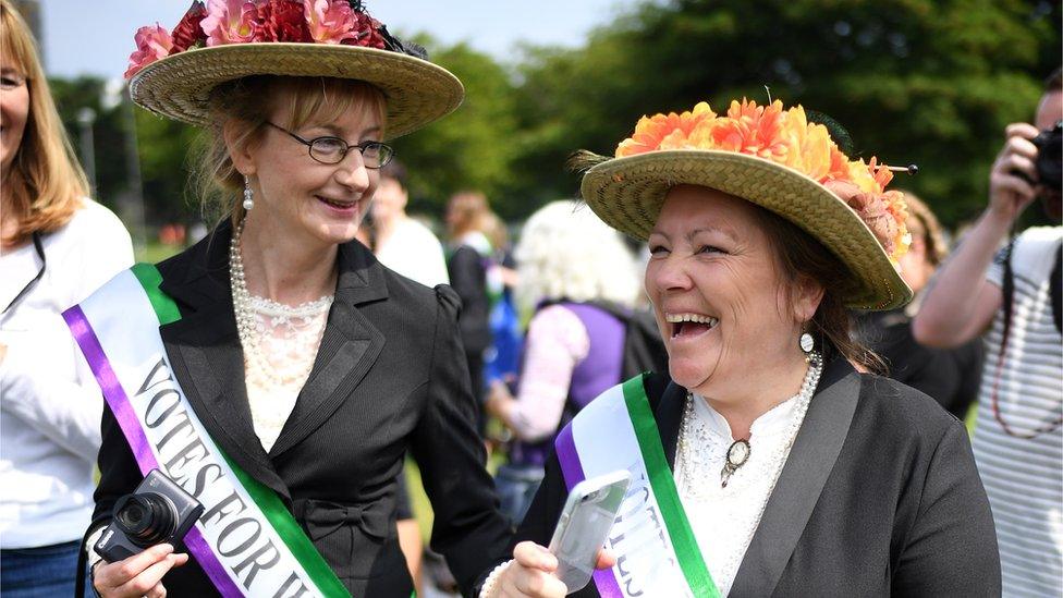 Women dressed as suffragettes