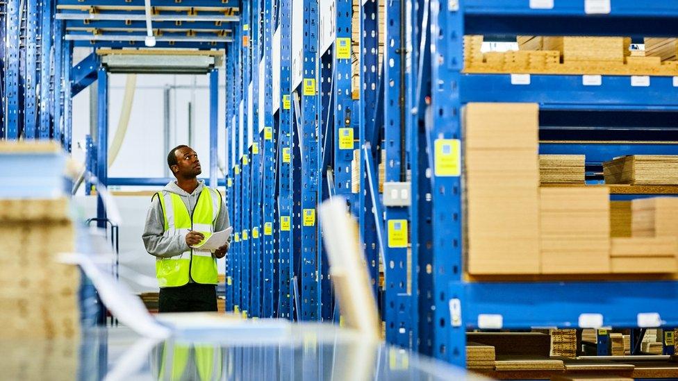 Black worker in a warehouse