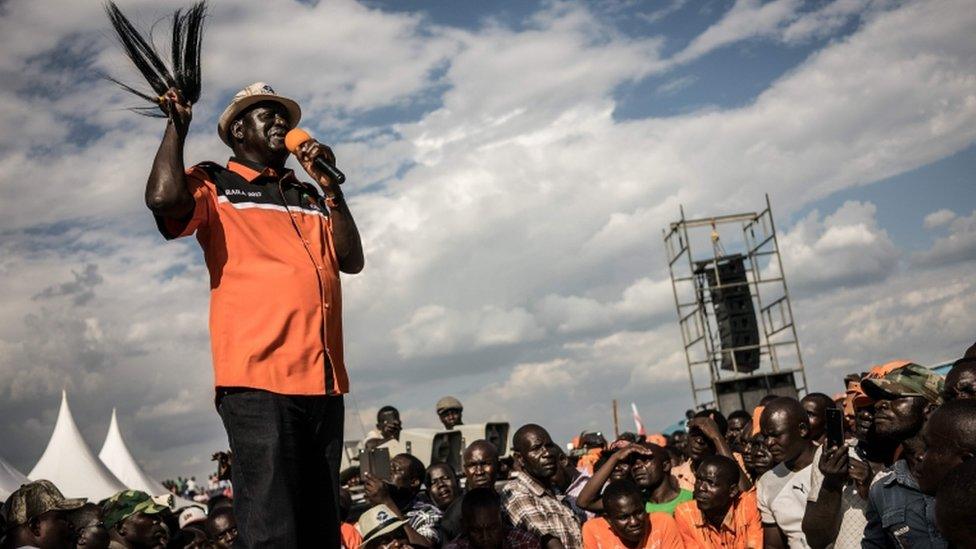 Kenyan presidential candidate Raila Odinga gestures as he addresses supporters at a rally held by his coalition party The National Super Alliance (NASA) in Kisumu on August 3, 2017.