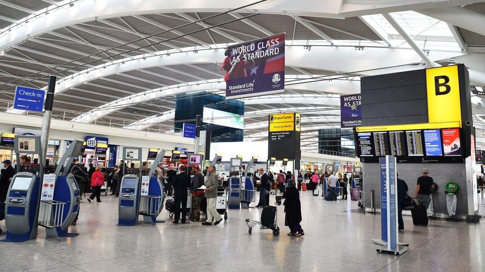 Passengers in Terminal 5 at Heathrow Airport