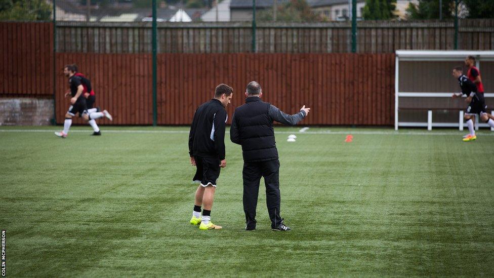 Edinburgh City manager Gary Jardine discusses tactics with a member of his squad