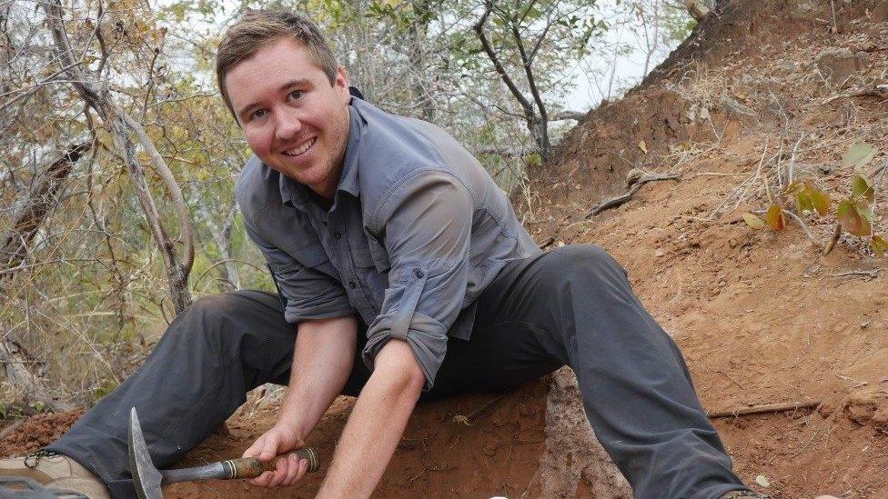 Christopher Griffin in 2017, excavating part of the Mbiresaurus raathi skeleton