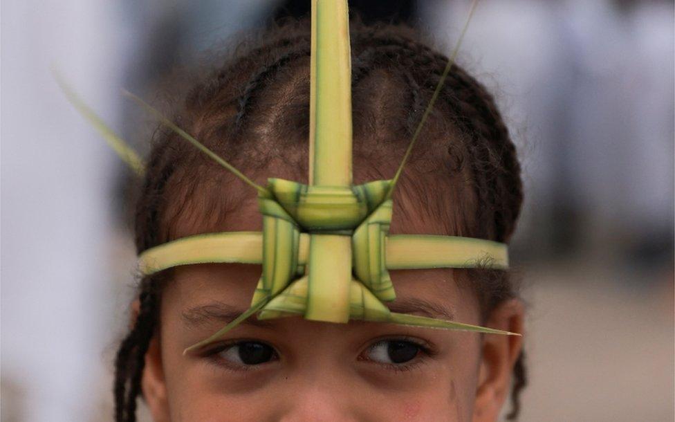 An Ethiopian Orthodox girl wears a palm headband.