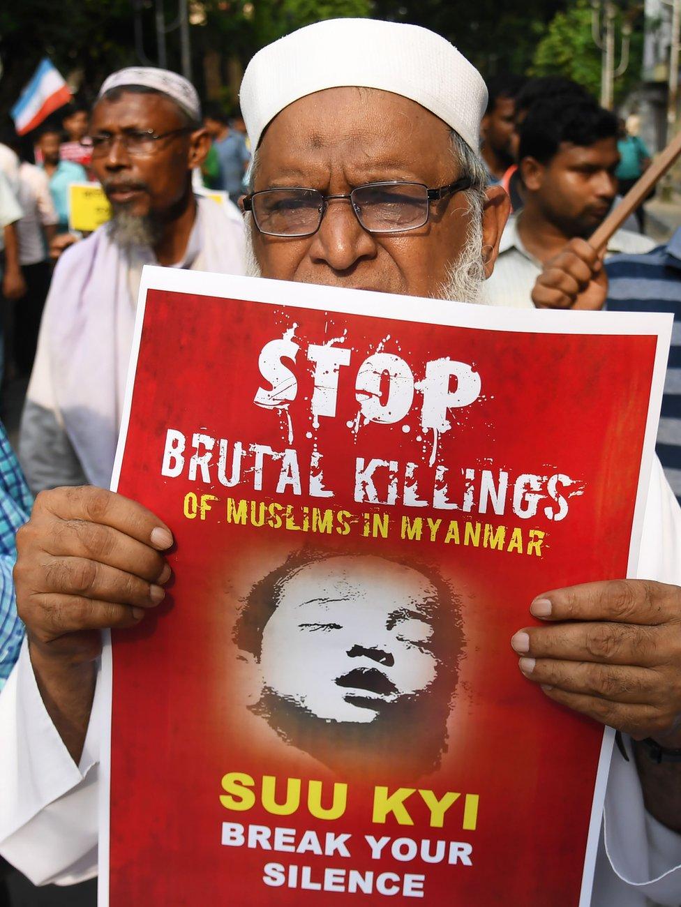 An Indian Muslim activist holds a placard calling on Aung San Suu Kyi to stop the killing of the Rohingya, pictured in a protest in Kolkata on 7 September 2017.