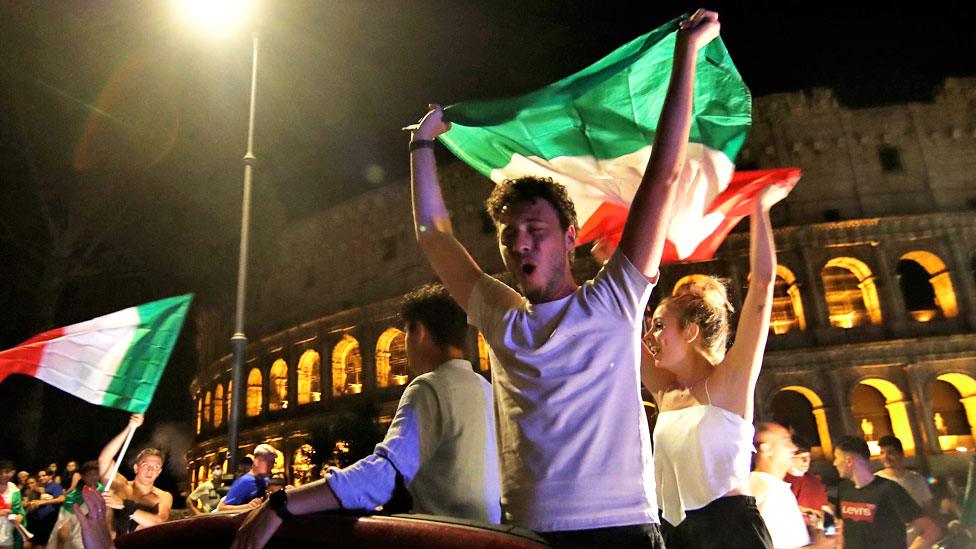 Italian fans outside Rome's Colosseum