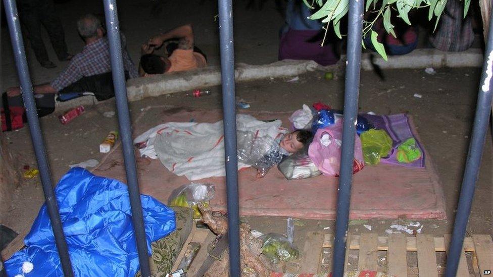 A baby who survived from a wreck sleeps outside the local coast guard office at Lakki port on the southeastern Greek island of Leros, Sunday, Sept. 13, 2015