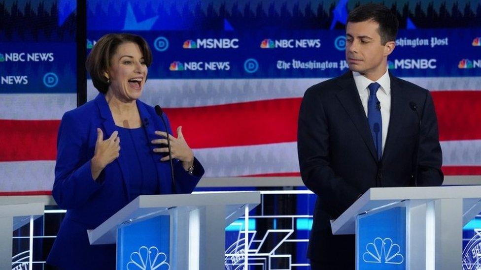 Amy Klobuchar speaks next to Pete Buttigieg