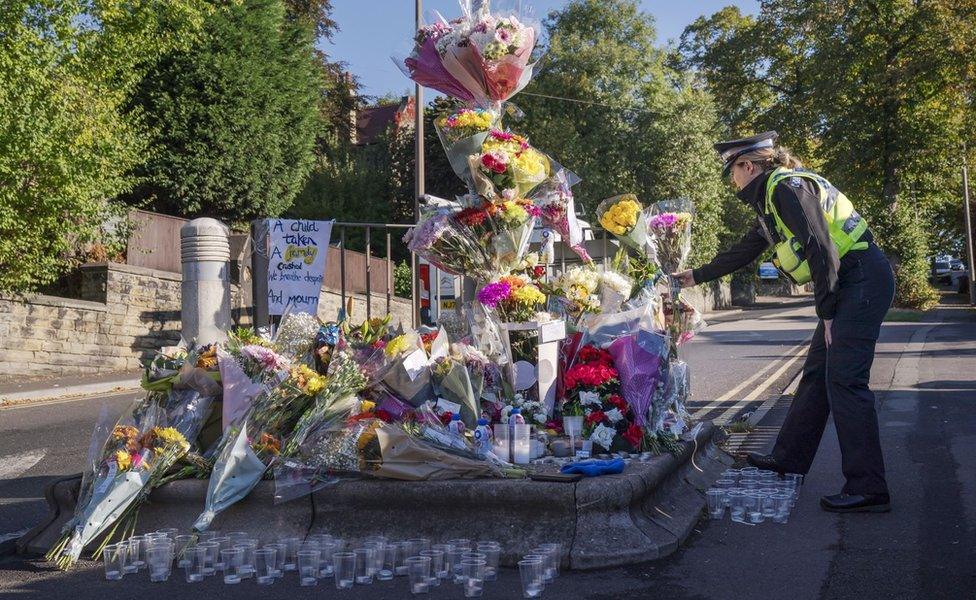 Flowers left at the scene in Woodhouse Hill, Huddersfield