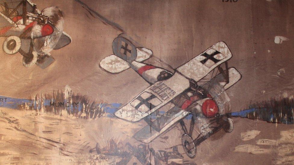 Two planes, one shot down, painted on the canvas