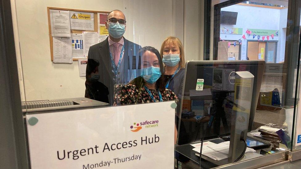 Medical staff at a reception desk