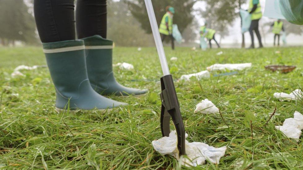 feet-of-someone-and-litter-picker.