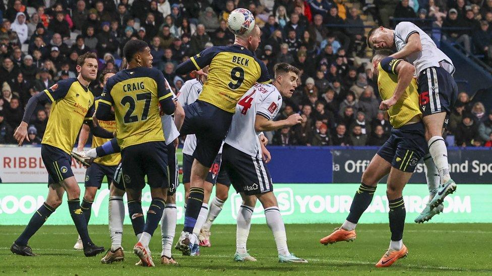 Solihull Moors and Bolton Wanderers playing an FA Cup tie