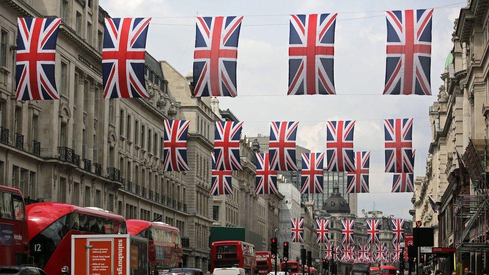 Union flags fly over Regent Street in London