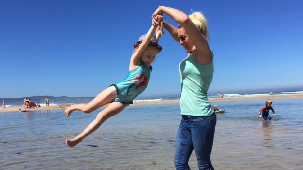 Rachel Bradford and Coco Rose Bradford playing in the sea