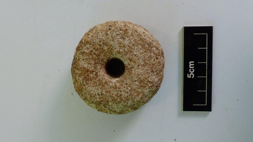 A stone Spindle Whorl