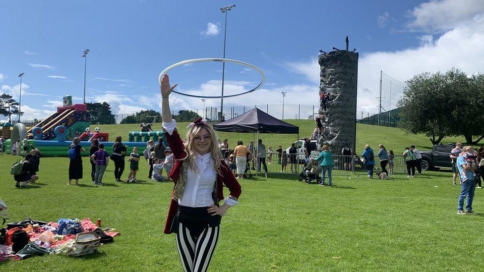 A circus performer at the teddy Bears Picnic at Féile an Phobail