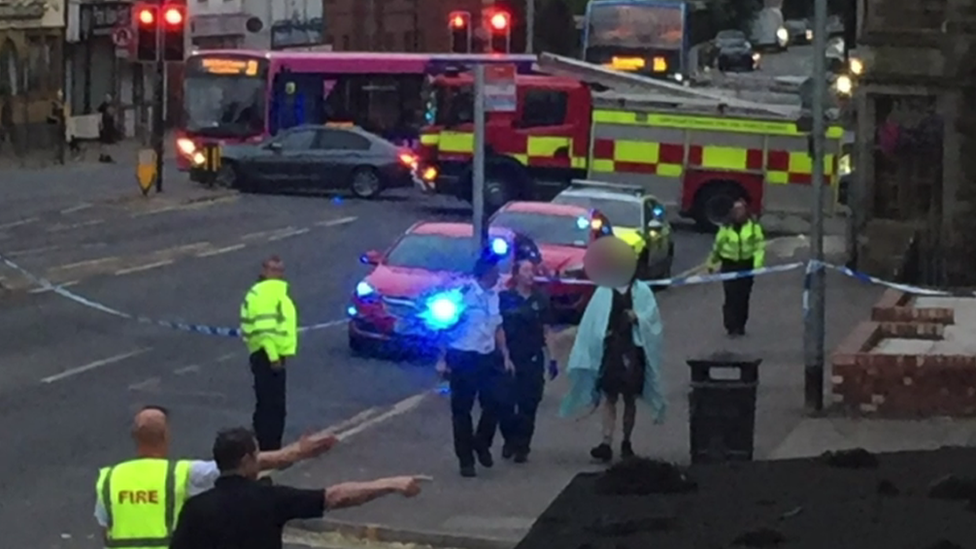 Emergency services including several fire engines and an ambulance at the scene where two of the boys were pulled free from the sewage system