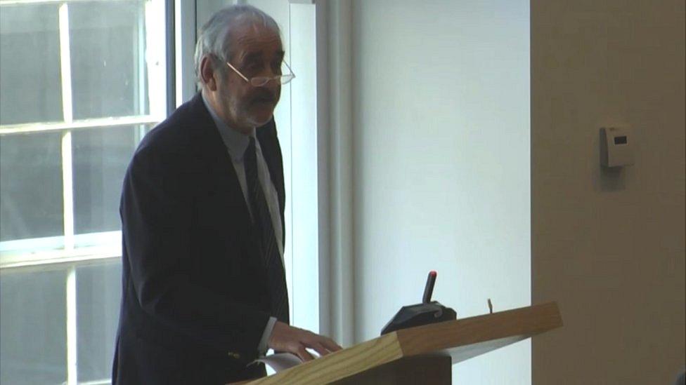 John Irving speaking at a council meeting