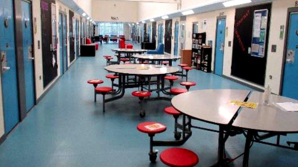 Tables in a corridor inside HMYOI Cookham Wood