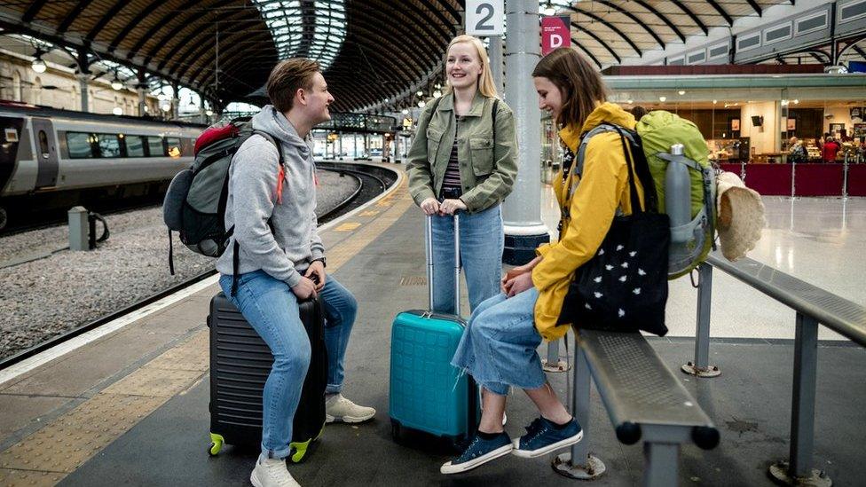 Students wait for train