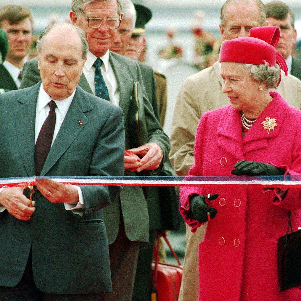 French President Francois Mitterand and Queen Elizabeth II prepare to cut the ribbon at the new terminal for the Channel Tunnel at Coquelles, France