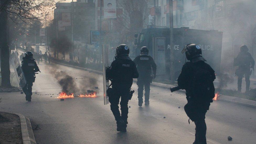 Police patrol the streets during during a protest in the centre of Kosovo's capital Pristina on 18 November 2015.