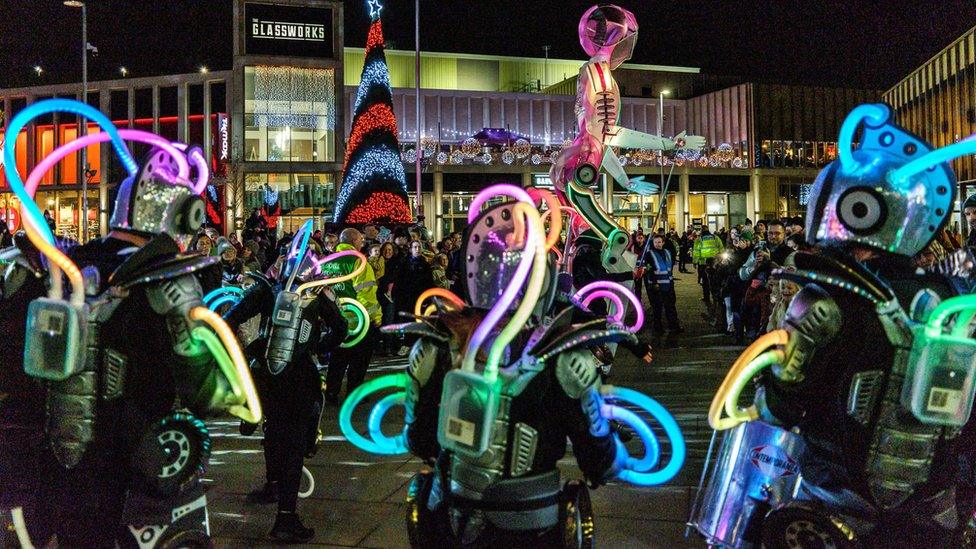 People taking part in light parade through town centre