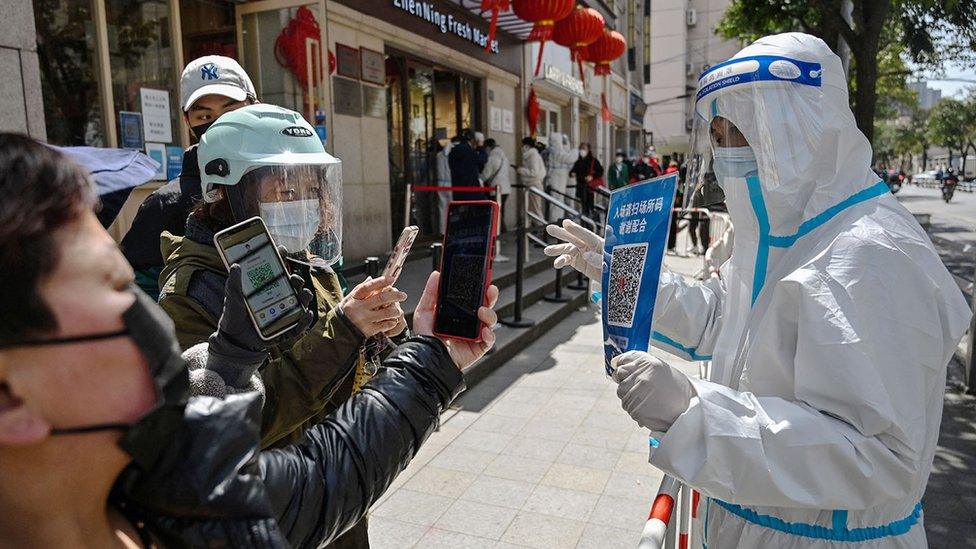 Chinese citizens scanning QR codes