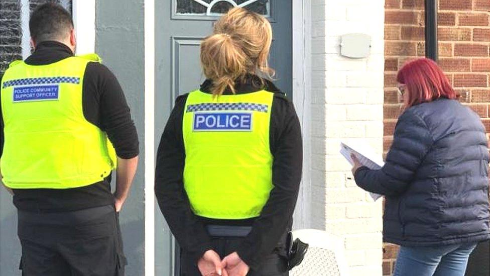 North Tyneside council worker and police visit a home