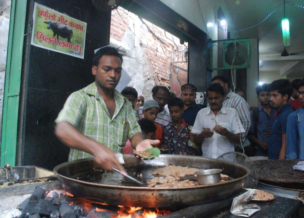 An Indian vendor makes kebabs made from beef at the Tundey Kebabi restaurant in Lucknow on May 17, 2017